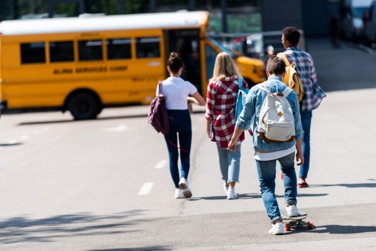 kids going on school bus